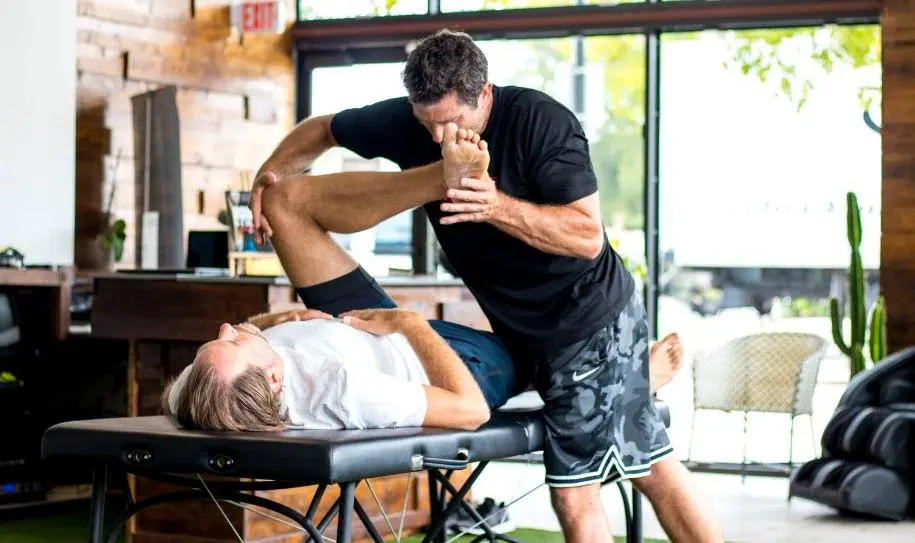 Matt Pack stretching a client on the table