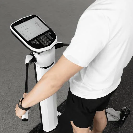 Client holding the handles of an InBody 580 analyzer during a body-composition measurement