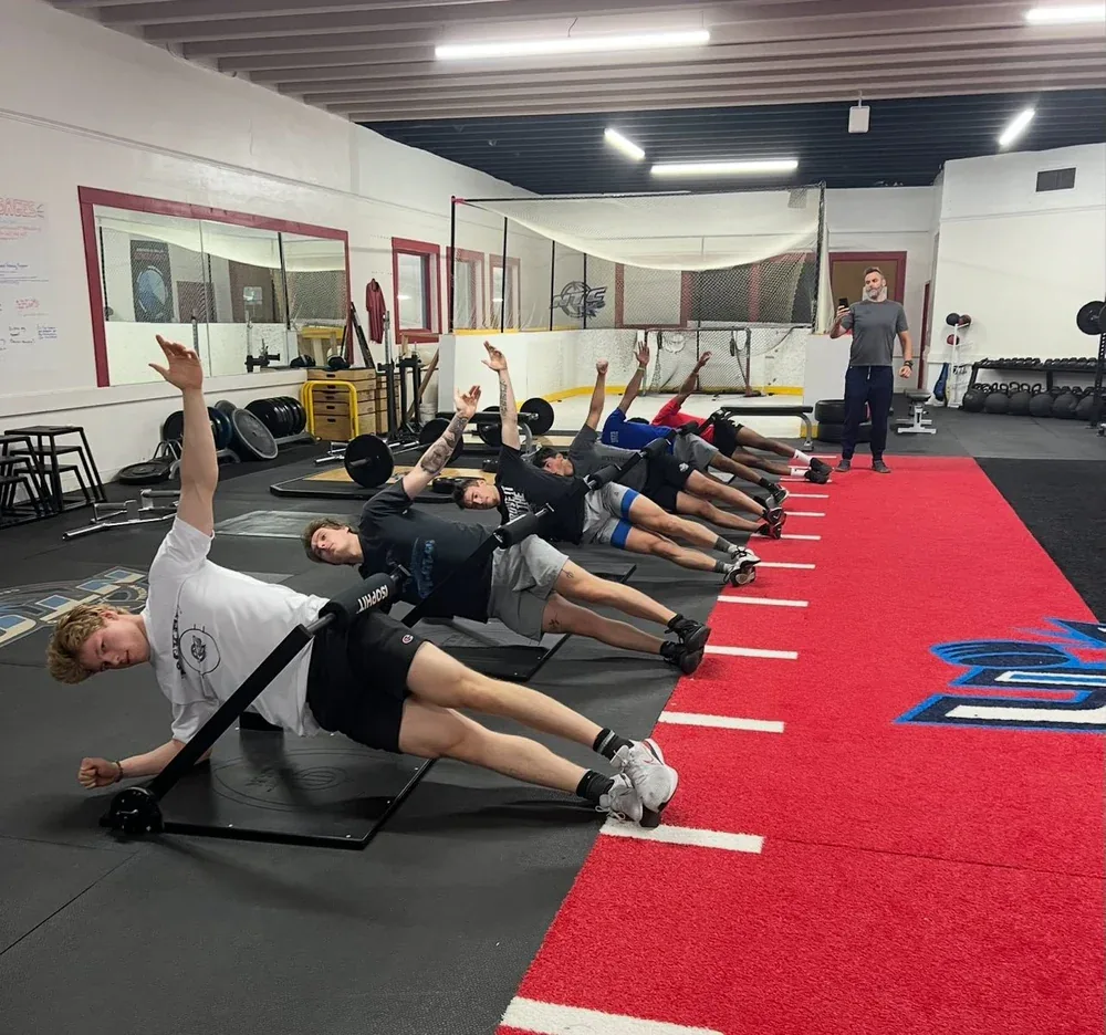 Participants practicing controlled movement on ISOPHIT equipment