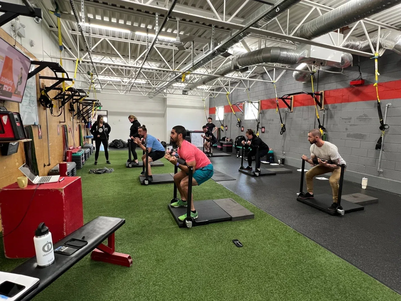 Small group completing coached ISOPHIT exercises